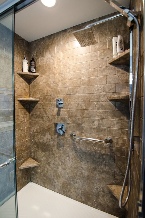 Corner shelves with subway tile in shower and white grout.  Shower corner  shelf, Amazing bathrooms, Bathroom corner shelf